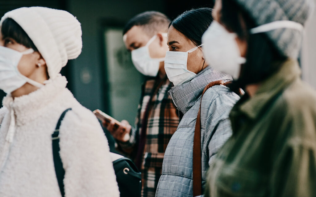 Traveling People Wearing Face Mask In A Covid Pandemic In Crowd, Public Or Airport Border With Passport Or Travel Restrictions. Foreigners Wearing Protection To Prevent The Spread Of Diseases Abroad